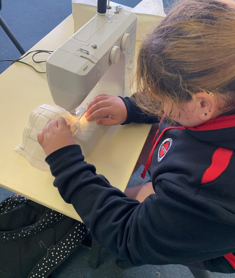 Student using sewing machine