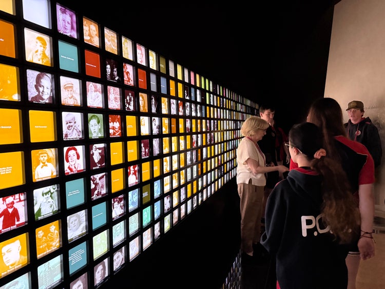 Students looking at memorial wall at Jewish Museum